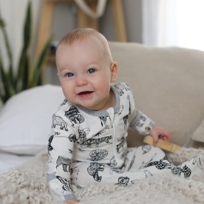 Animal kingdom printed footie in sustainable fabric